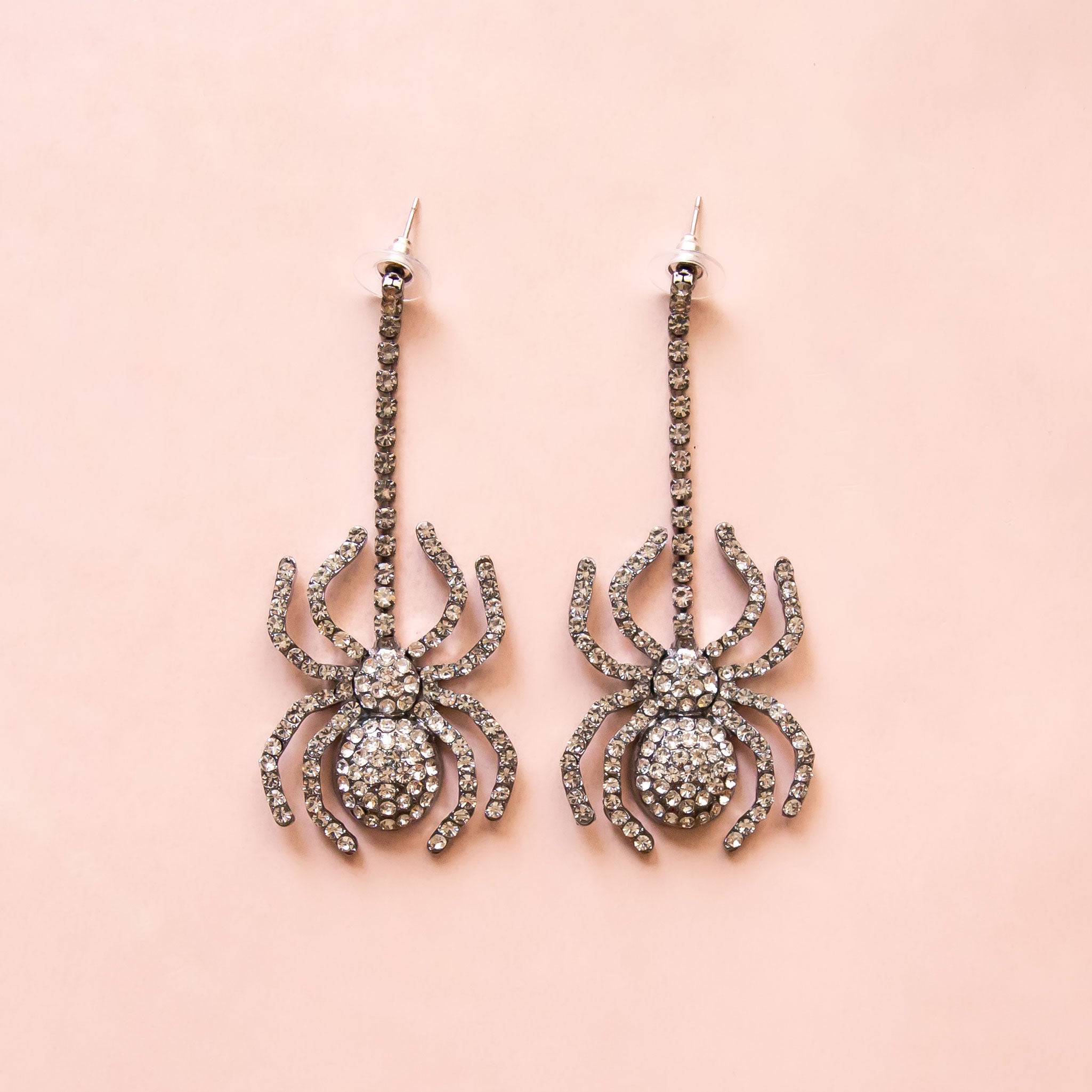 Dangling black spider earrings with CZ stones. 